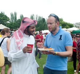 Our students chat during a break at IE's Global Village event..jpg
